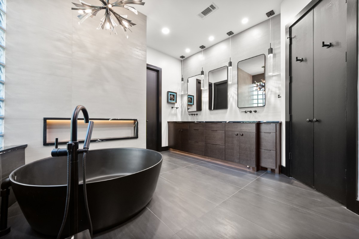 Modern Bathroom with Freestanding Black Tub and Dual Vanity