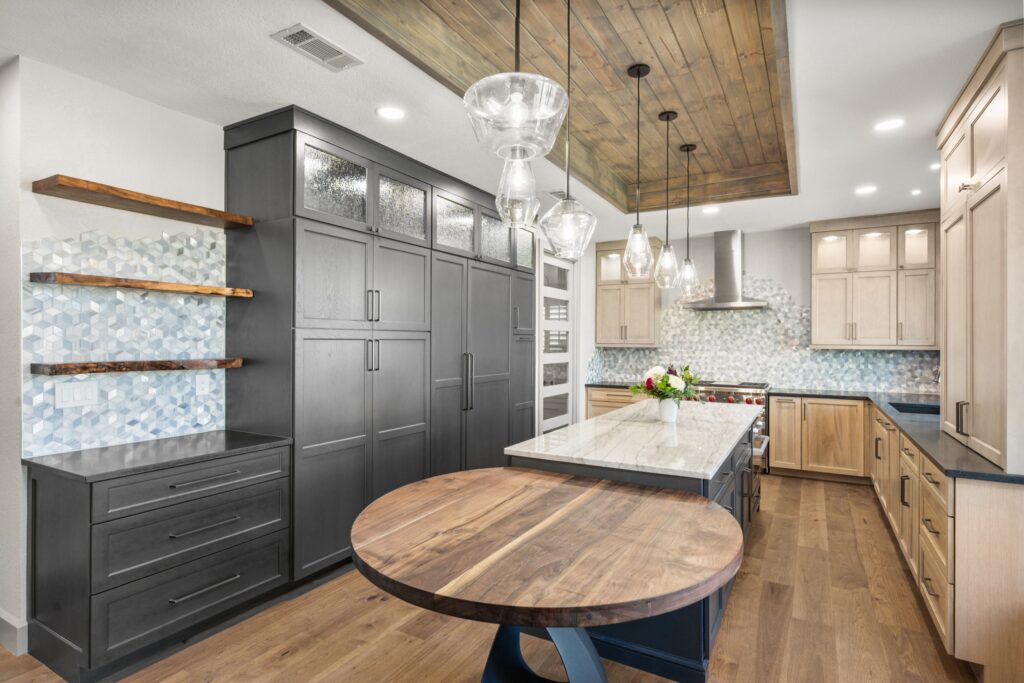 Kitchen with dark pantry cabinets, a wood ceiling, and a round walnut table