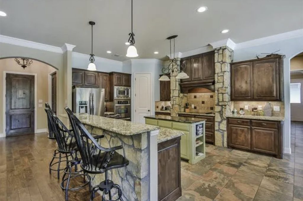 Rustic Kitchen Before Remodel Low Angle View Stone Breakfast Bar Dark Wood Cabinets